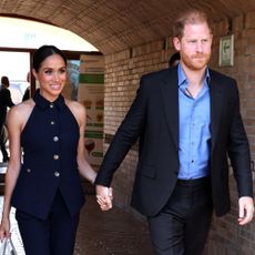 Meghan Markle wears a white handbag.