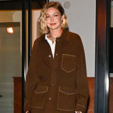 Gigi Hadid wears brown croc boots.